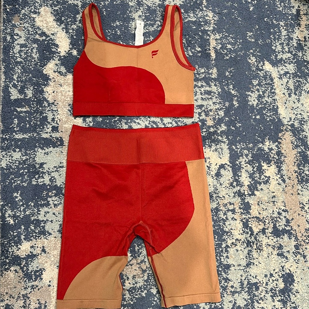 Like new. Fabletics Athletic set. Worn once. Pants XL. Top. L
